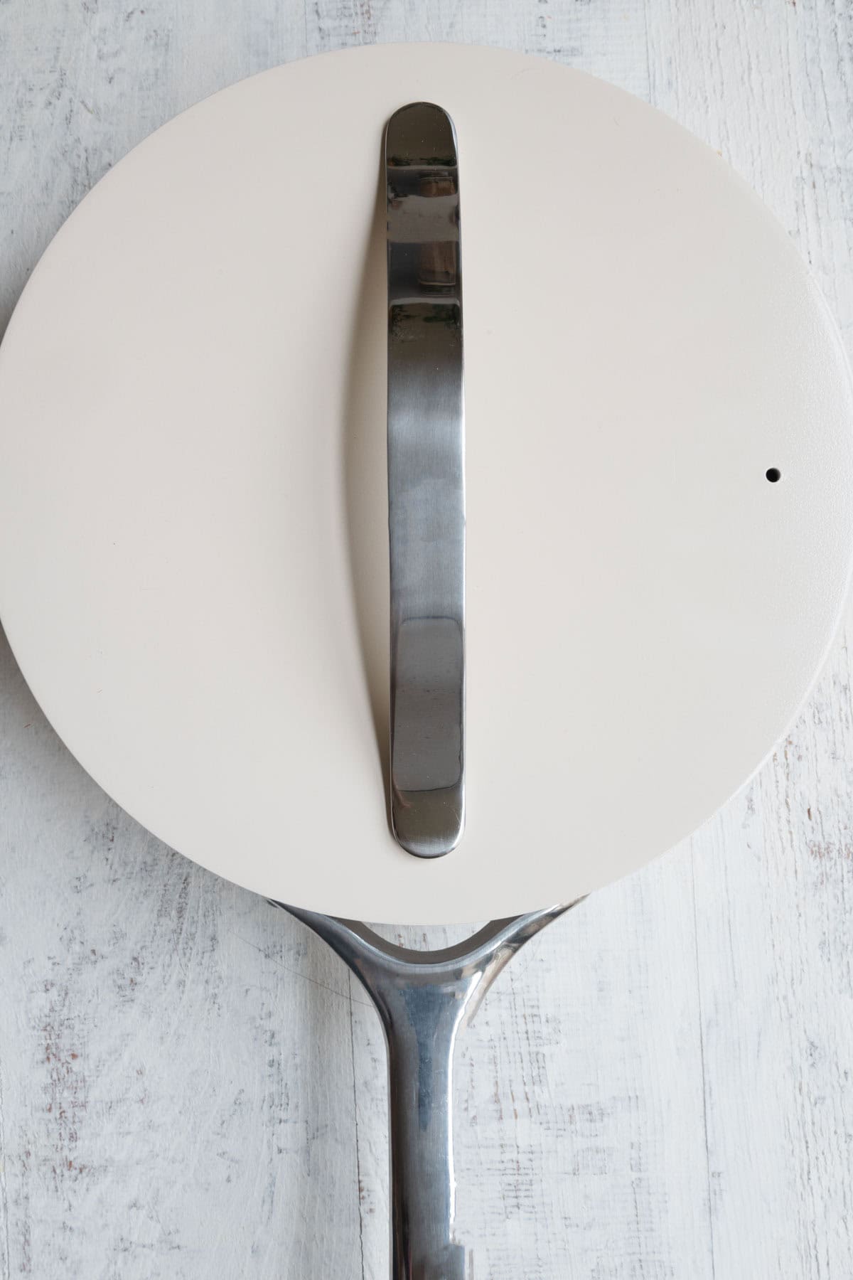 Nonstick Caraway saucepan with a lid on top.