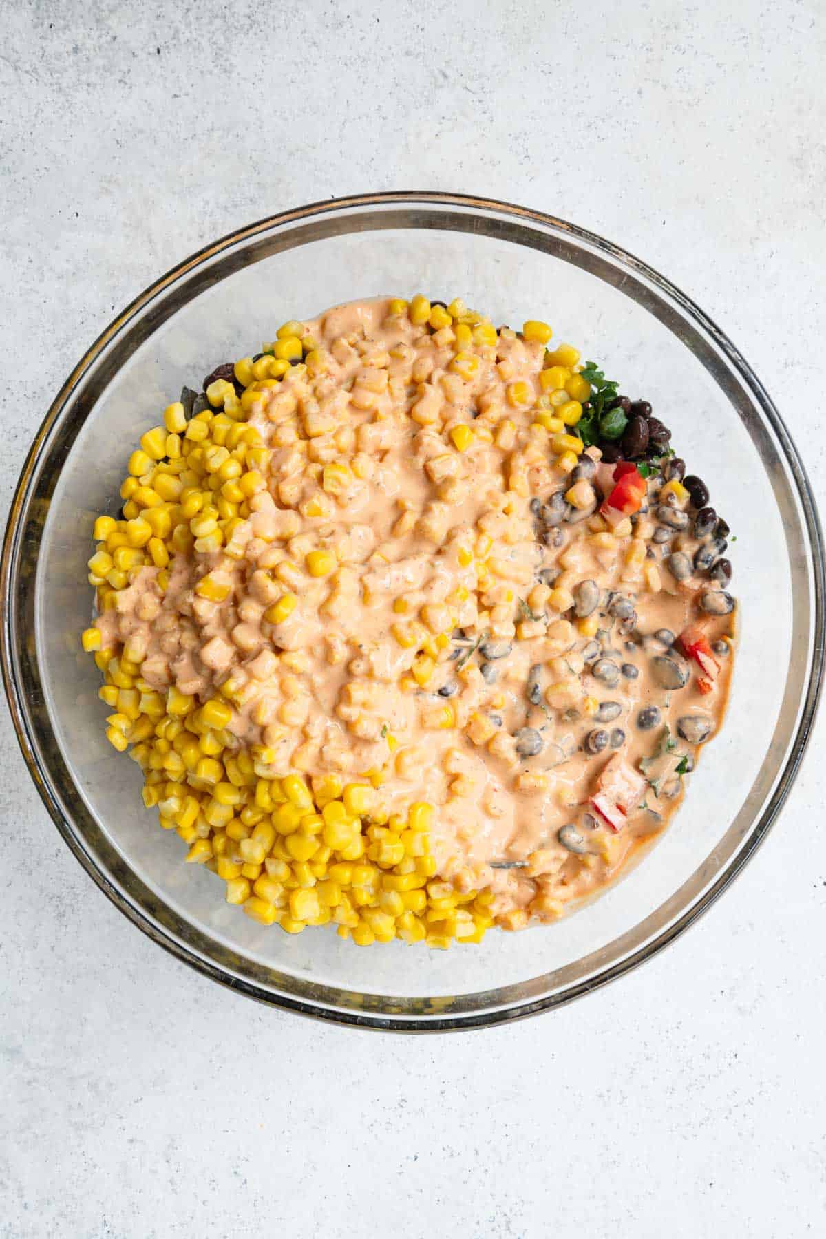 Black bean, corn, kale, red bell pepper, shallot, and avocado mixed with chipotle dressing.