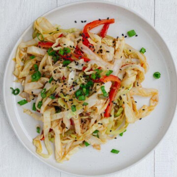 Cabbage stir-fry on a white plate.