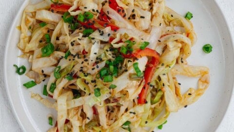 Cabbage stir-fry on a white plate.