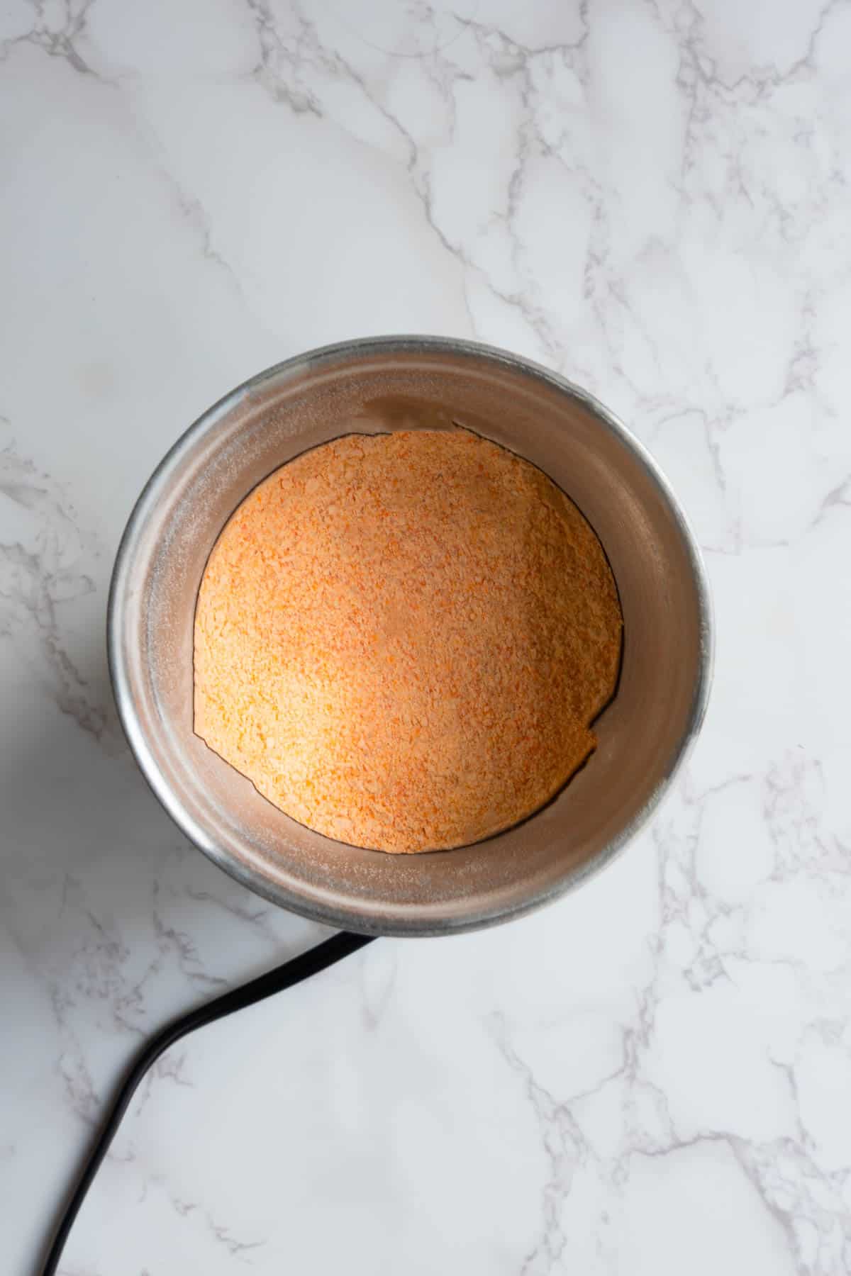 Ground red lentils in a spice grinder.