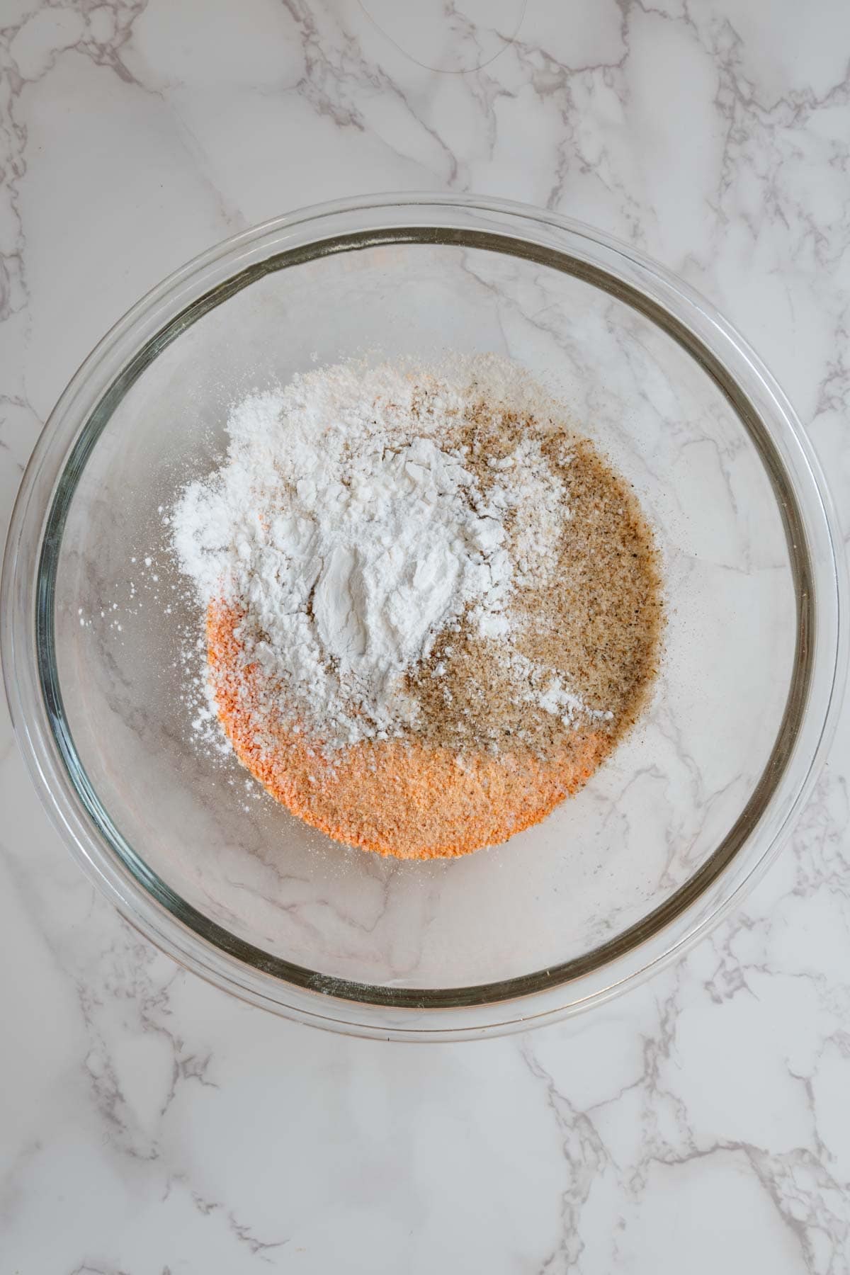 Tapioca starch. lentil flour, and psyllium husk in a glass bowl.