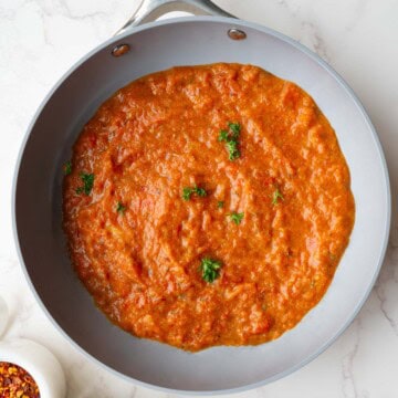 Homemade spaghetti sauce with fresh tomatoes in a skillet.