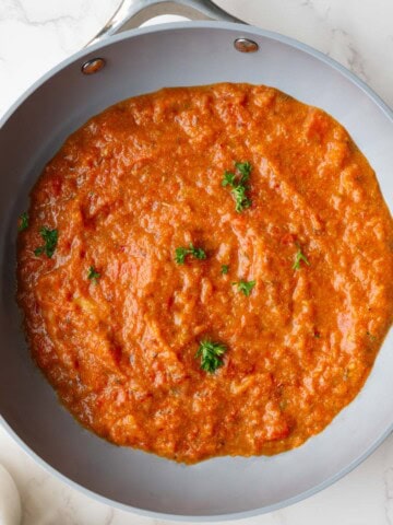 Homemade spaghetti sauce with fresh tomatoes in a skillet.