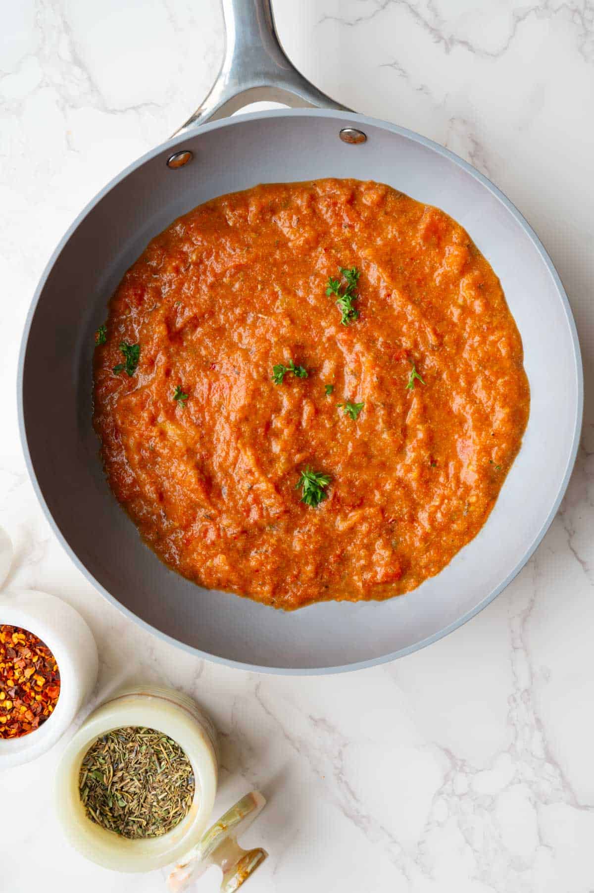 Homemade spaghetti sauce with fresh tomatoes in a skillet.