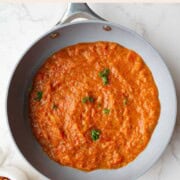 Homemade spaghetti sauce with fresh tomatoes in a skillet.