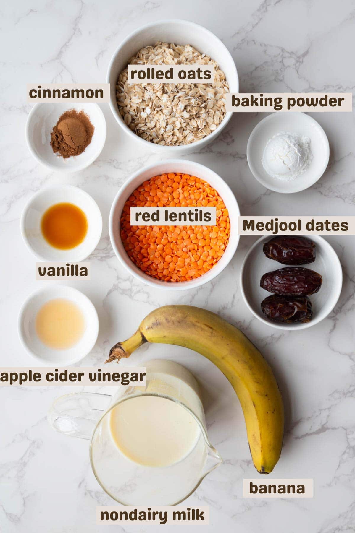 Rolled oats, cinnamon, baking powder, red lentils, vanilla, dates, banana, nondairy milk, and apple cider vinegar.
