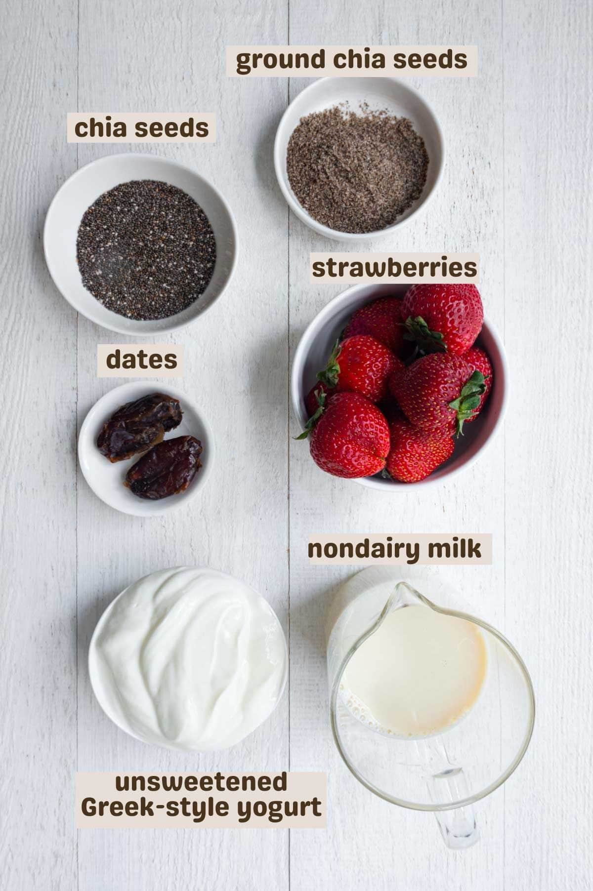Whole chia seeds, ground chia seeds, strawberries, Greek-style yogurt, nondairy milk, and dates.