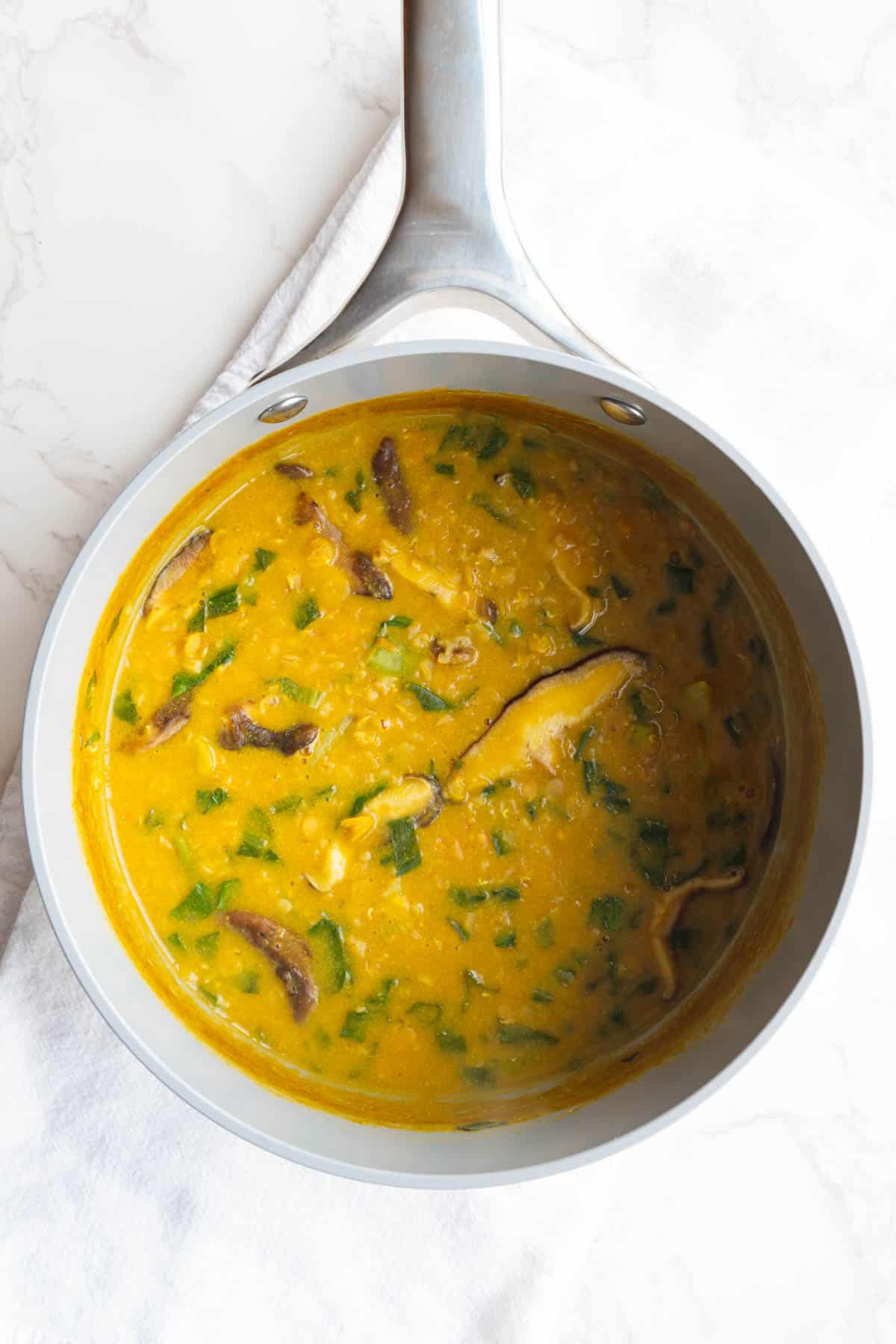Savory protein porridge cooking in a saucepan.