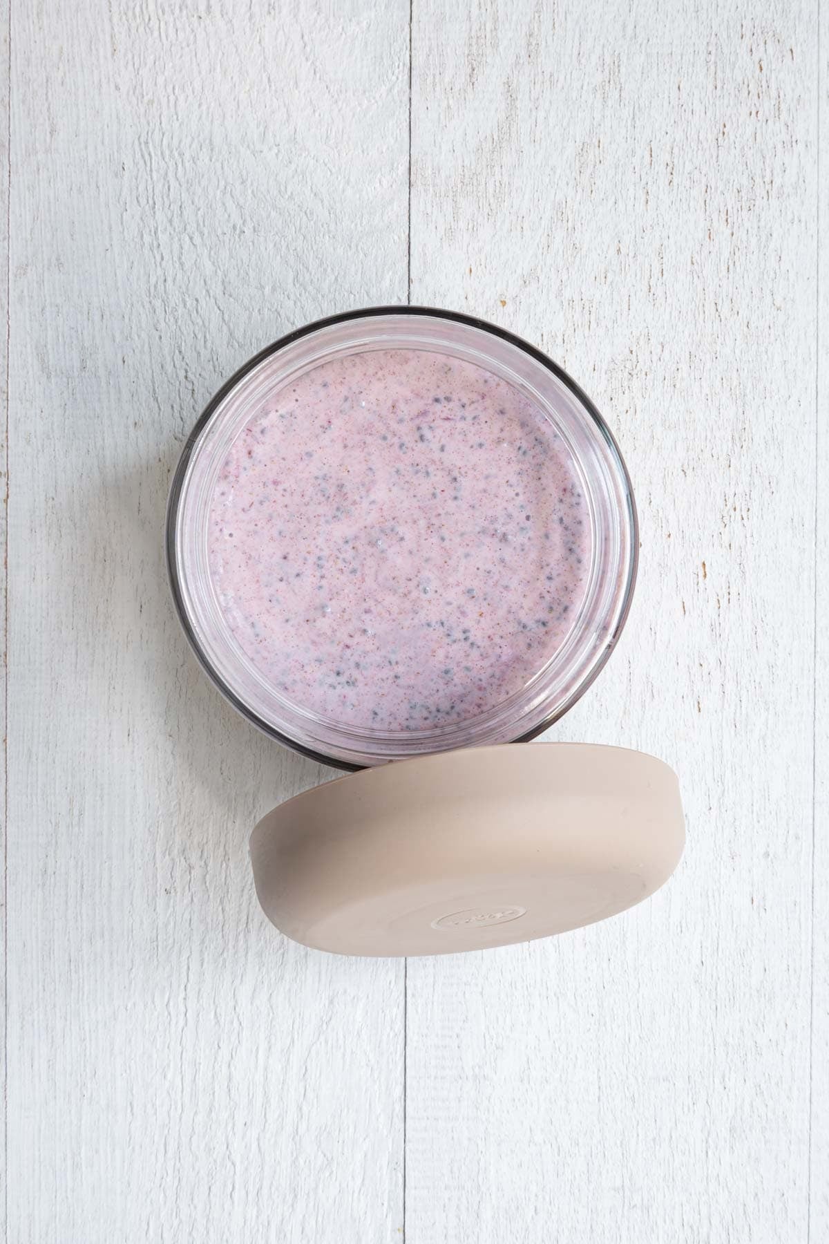 Strawberry chia pudding in a meal prep container.