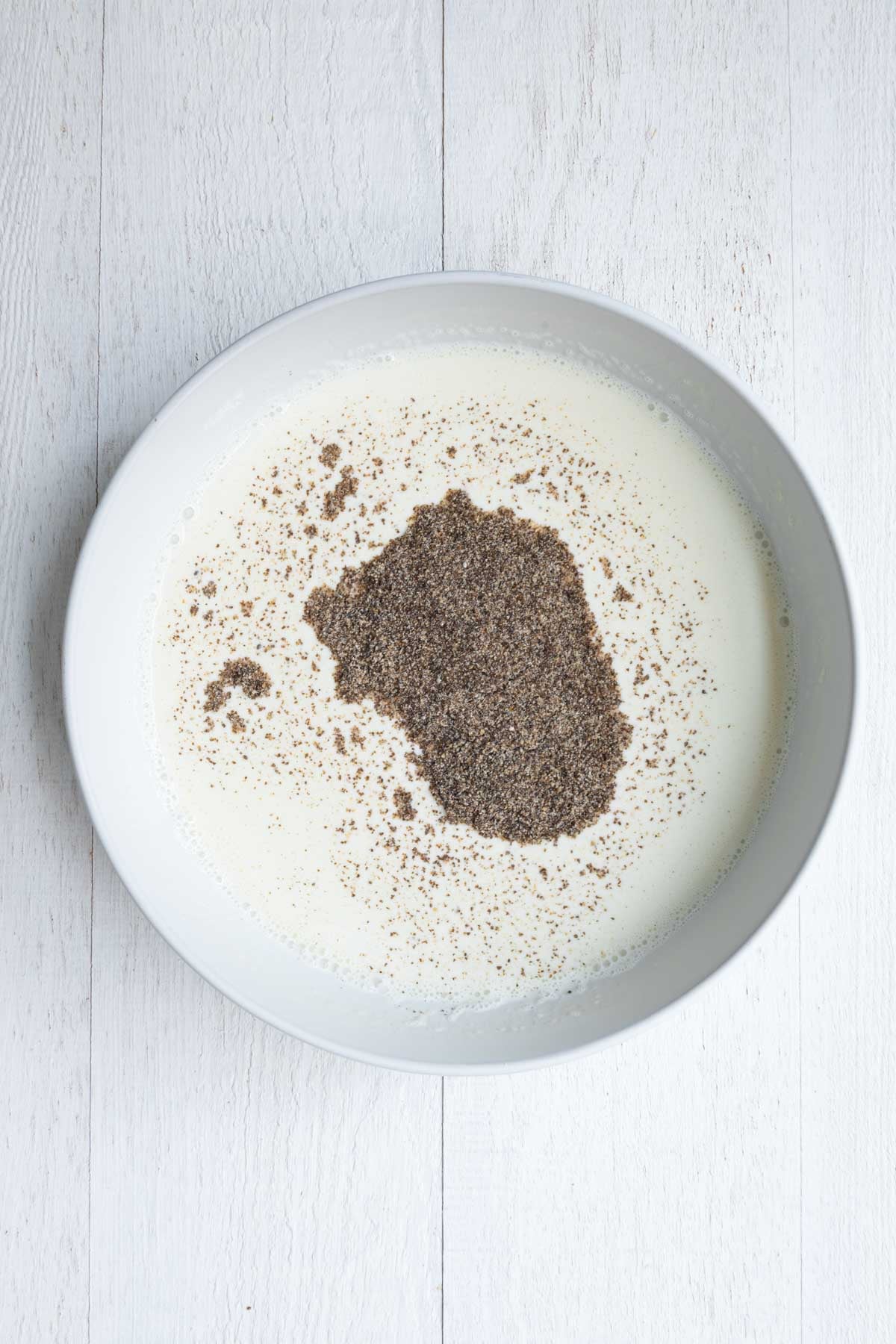 Nondairy milk whisked into Greek yogurt topped with ground chia seeds.