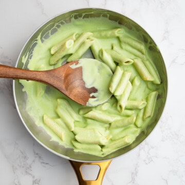 High-protein tofu pesto with pasta in a saucepan.