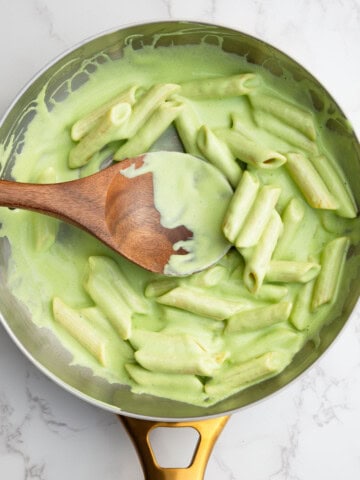 High-protein tofu pesto with pasta in a saucepan.