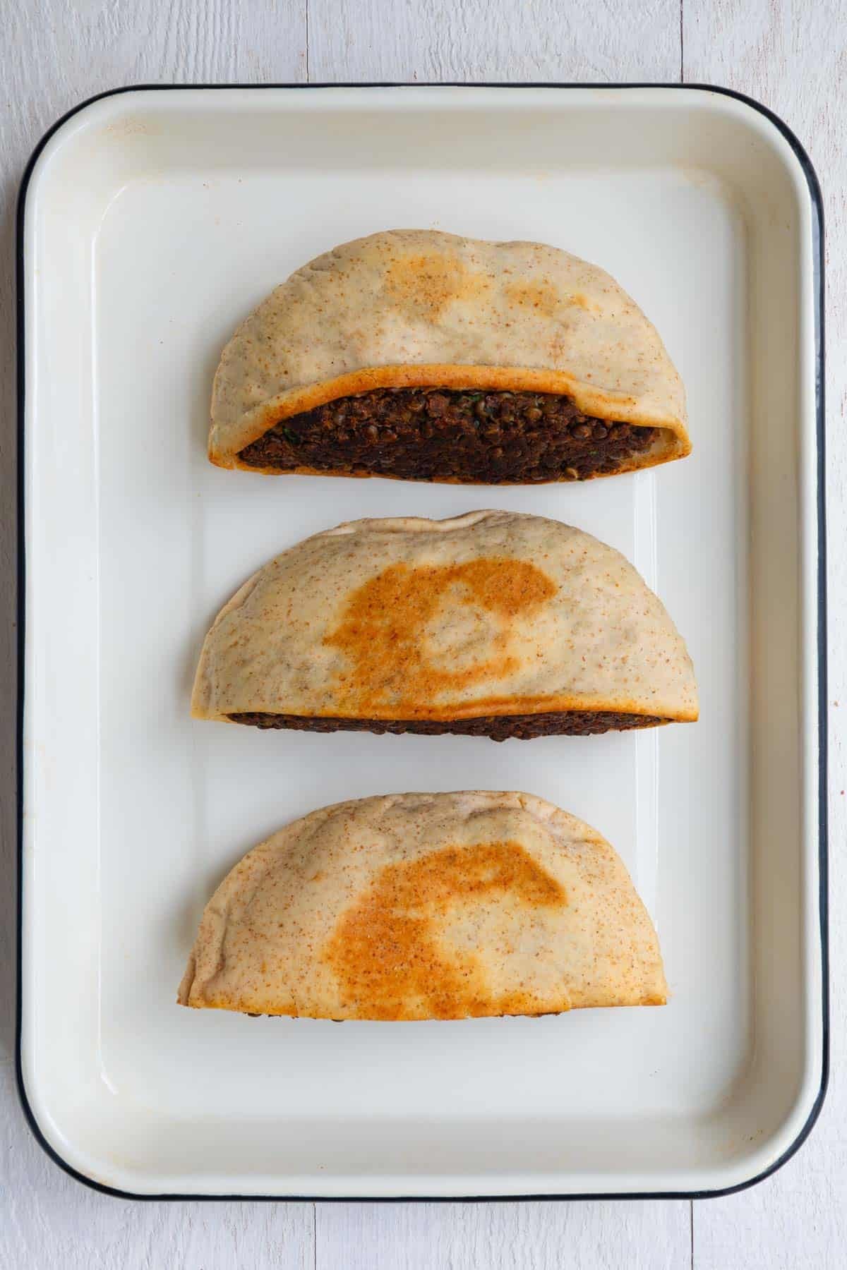 Three arayes on a baking sheet.