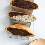 Crispy Lebanese arayes stuffed with lentil meat and drizzled with ypgurt sauce.
