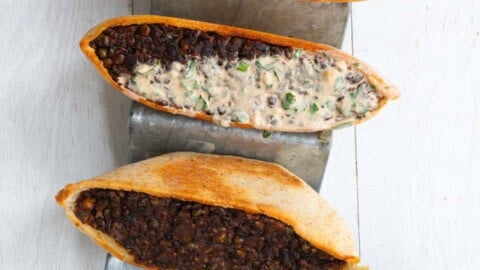 Crispy Lebanese arayes stuffed with lentil meat and drizzled with ypgurt sauce.