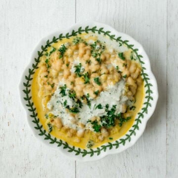 Creamy white beans topped with hemp cream and chopped parsley.
