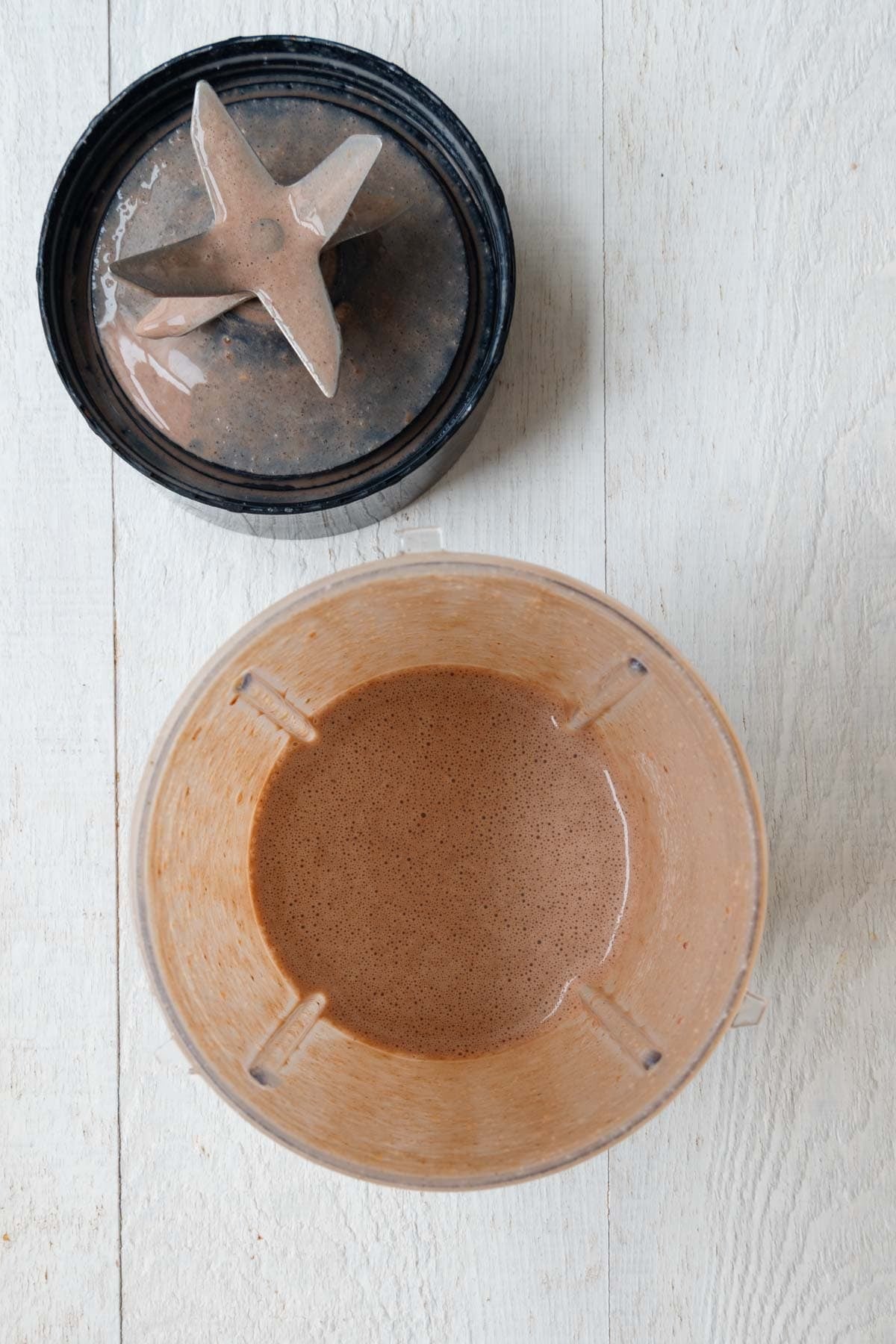 Brown blended creamy liquid in a blender.