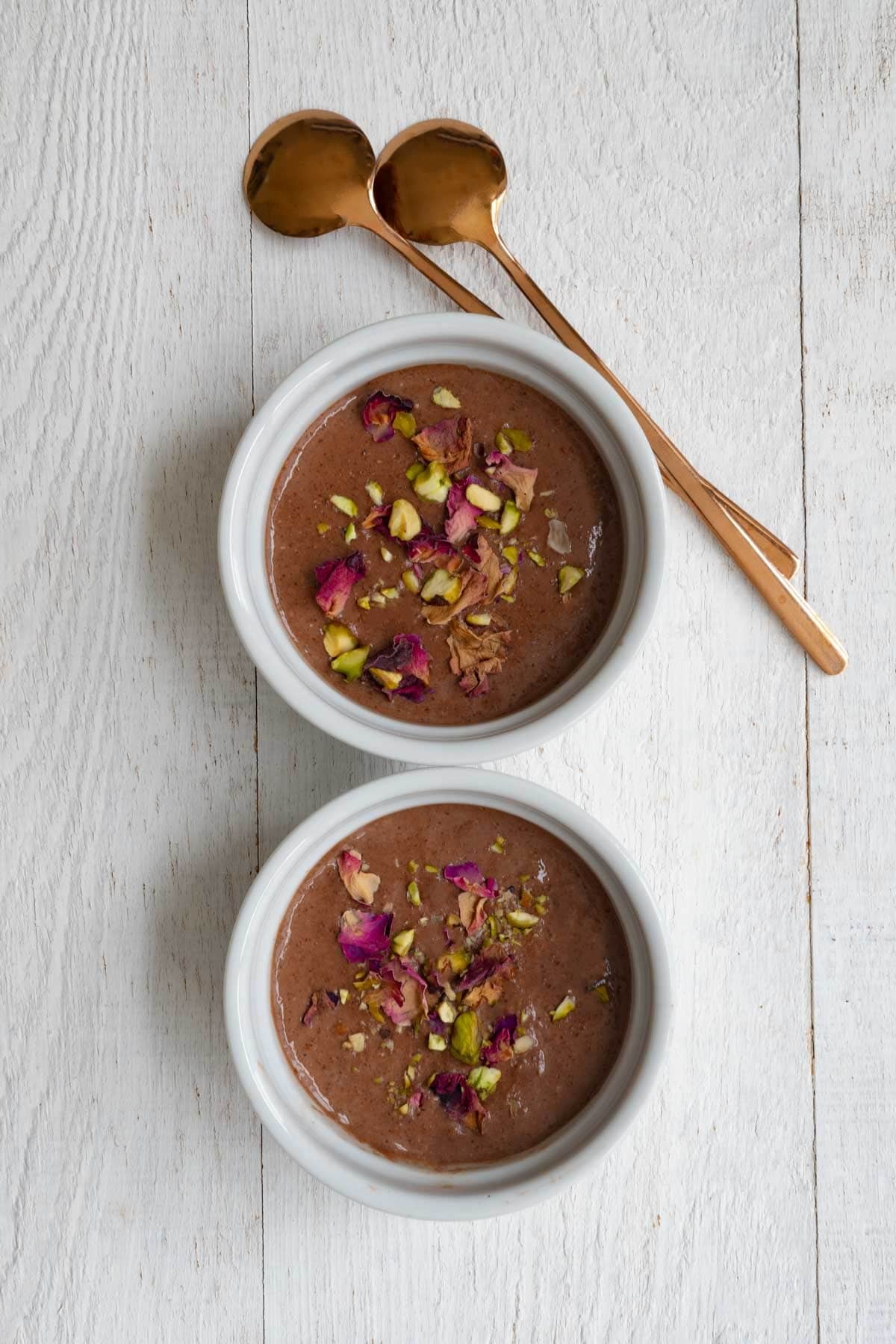 Healthy chocolate pudding in two ramekins.