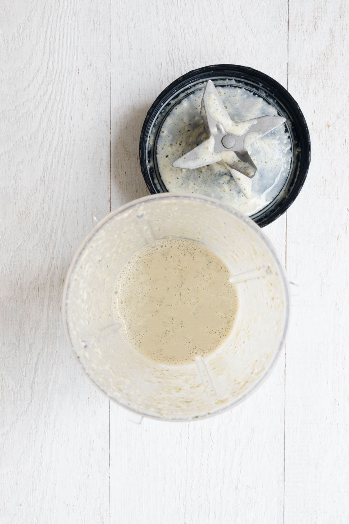 Creamy white liquid in a blender.