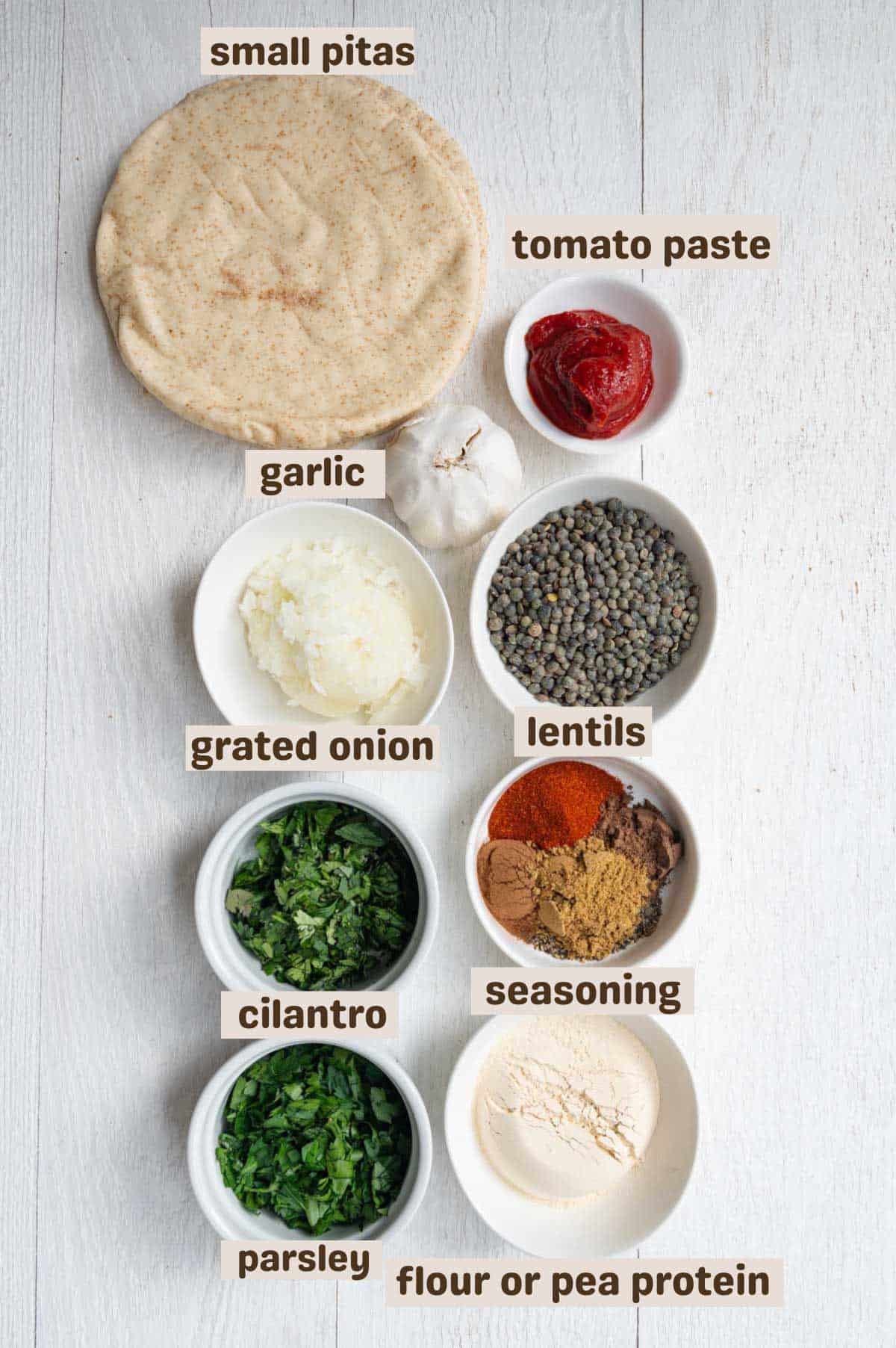 Small pita breads, cilantro, parsley, oat flour or pea protein, seasoning, lenitls, tomato paste, and garlic.