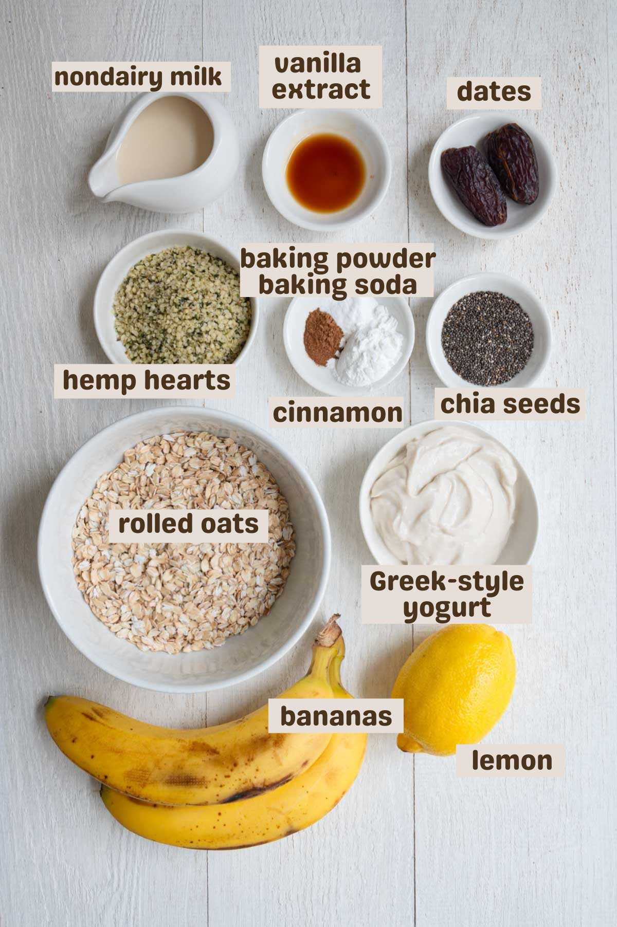 Rolled oats, baking soda, baking powder, cinnamon, chia seeds, banana, vanilla, yogurt, lemon, dates, hemp hearts, chia seeds, and nondairy milk.