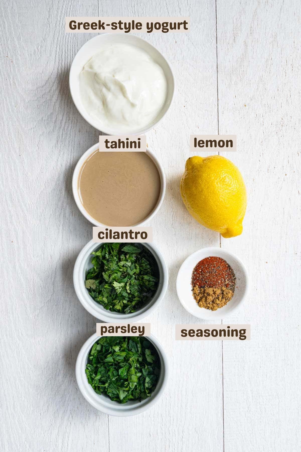 Greek yogurt, lemon, tahini, seasoning, cilantro, and parsley.