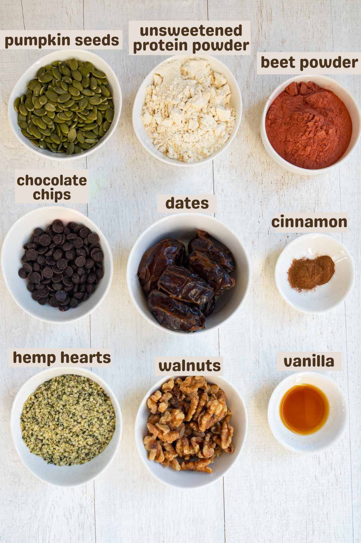 Pumpkin seeds, walnuts, hemp hearts, vanilla, dates, chocolate chips, beet powder, and unsweetened protein powder.