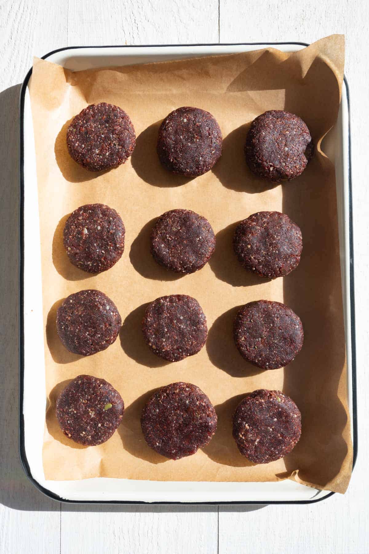 Twelve pre workout snack cookies on parchment paper.