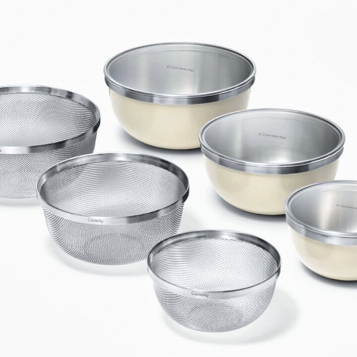 Three Caraway stackable bowls and strainer set.