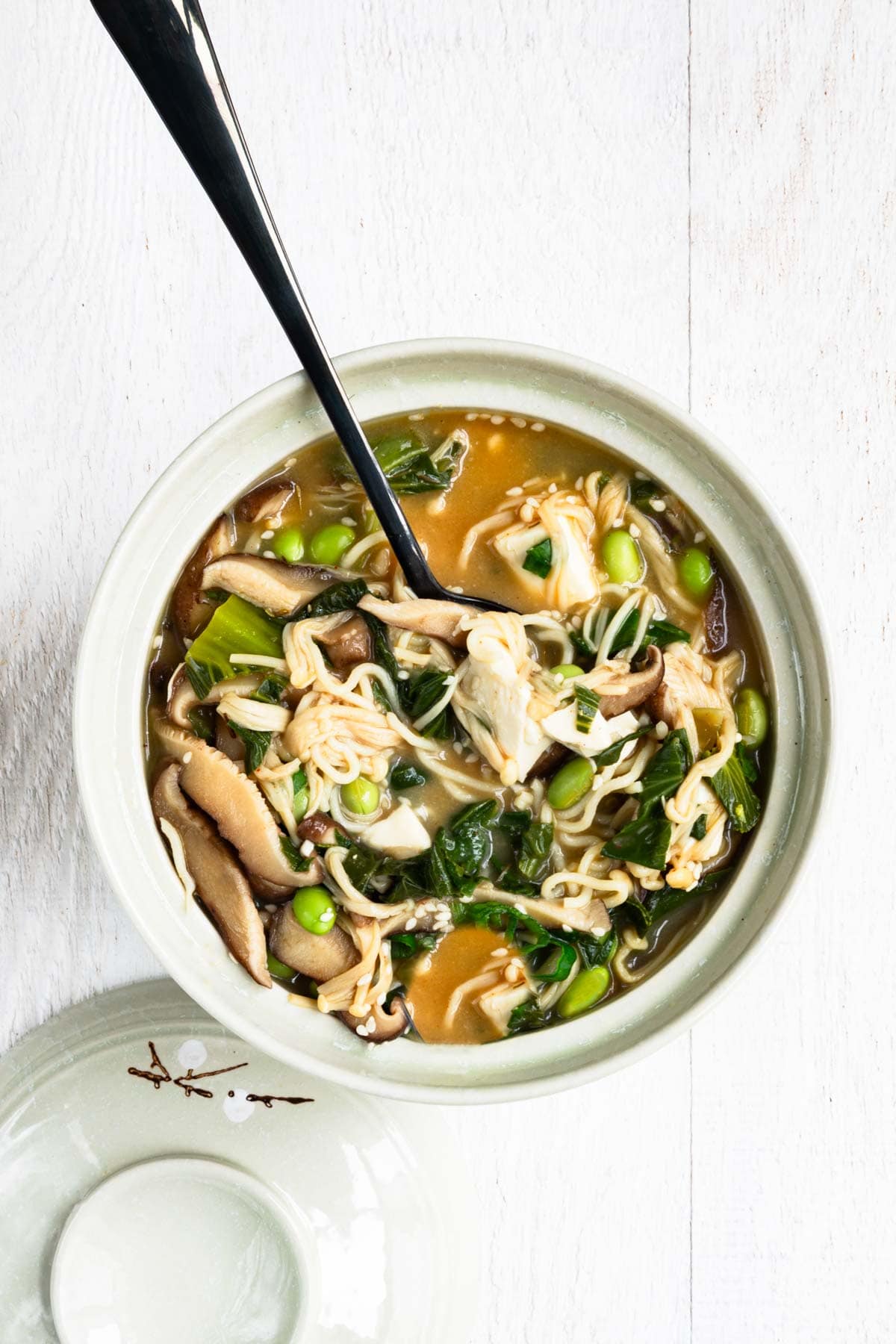 Easy vegan ramen with silken tofu and mushrooms in a bowl.