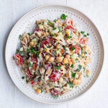 Greek Orzo Pasta Salad on a white plate.