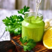 Herb Greek yogurt sauce in a glass jar.