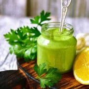 Herb Greek yogurt sauce in a glass jar.