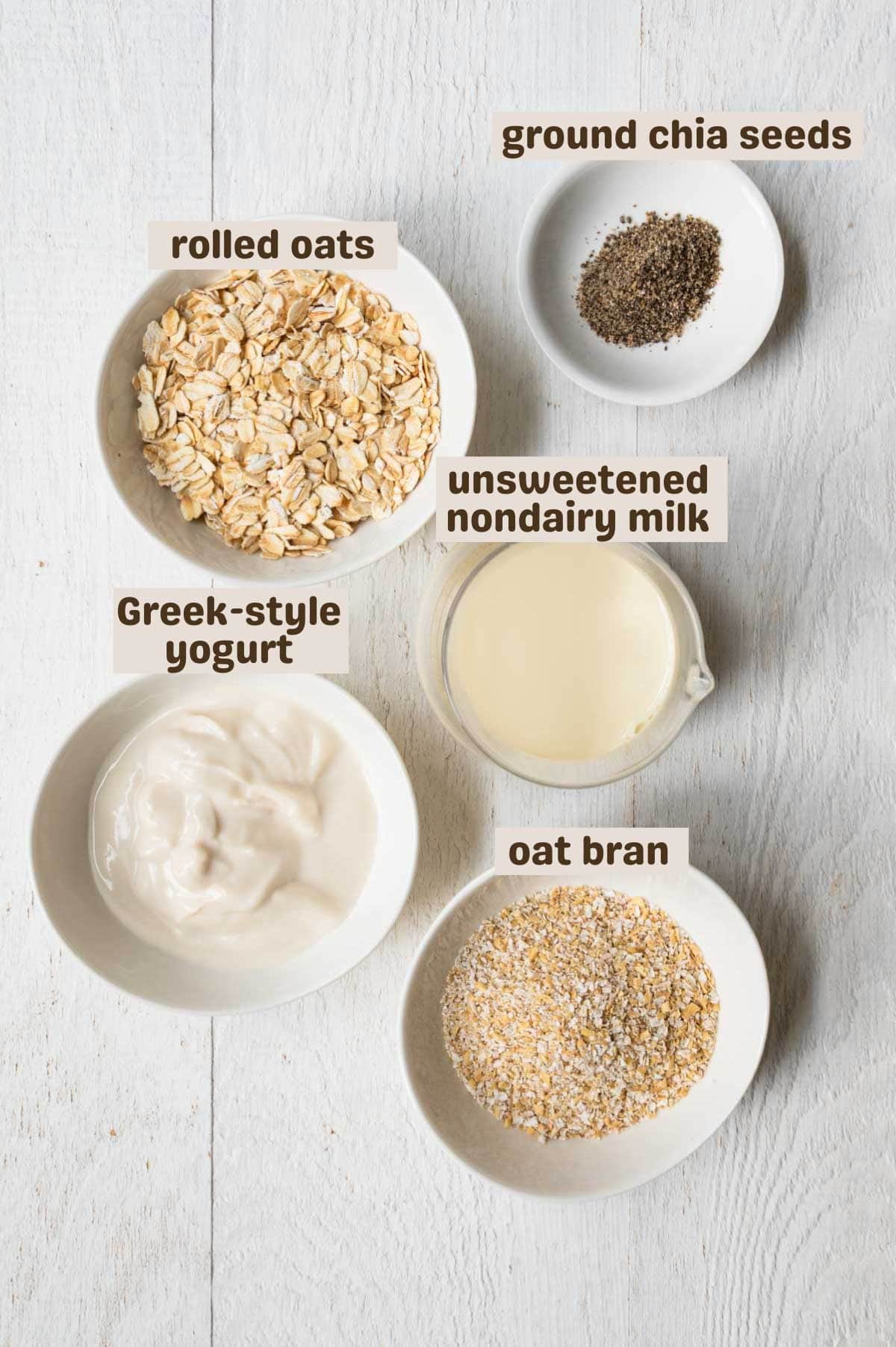 Rolled oats, oat bran, Greek yogurt, unsweetened nondairy milk, and ground chia seeds.