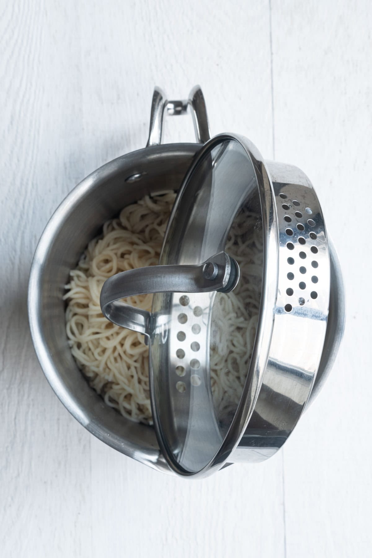 Cooked noodles in a saucepan.