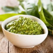 Creamy pumpkin seed pesto in a white bowl.