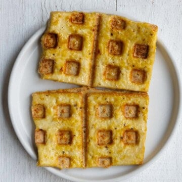 Tofu waffles on a white plate.