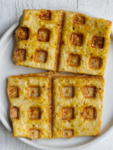 Tofu waffles on a white plate.