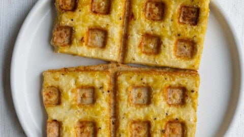 Tofu waffles on a white plate.