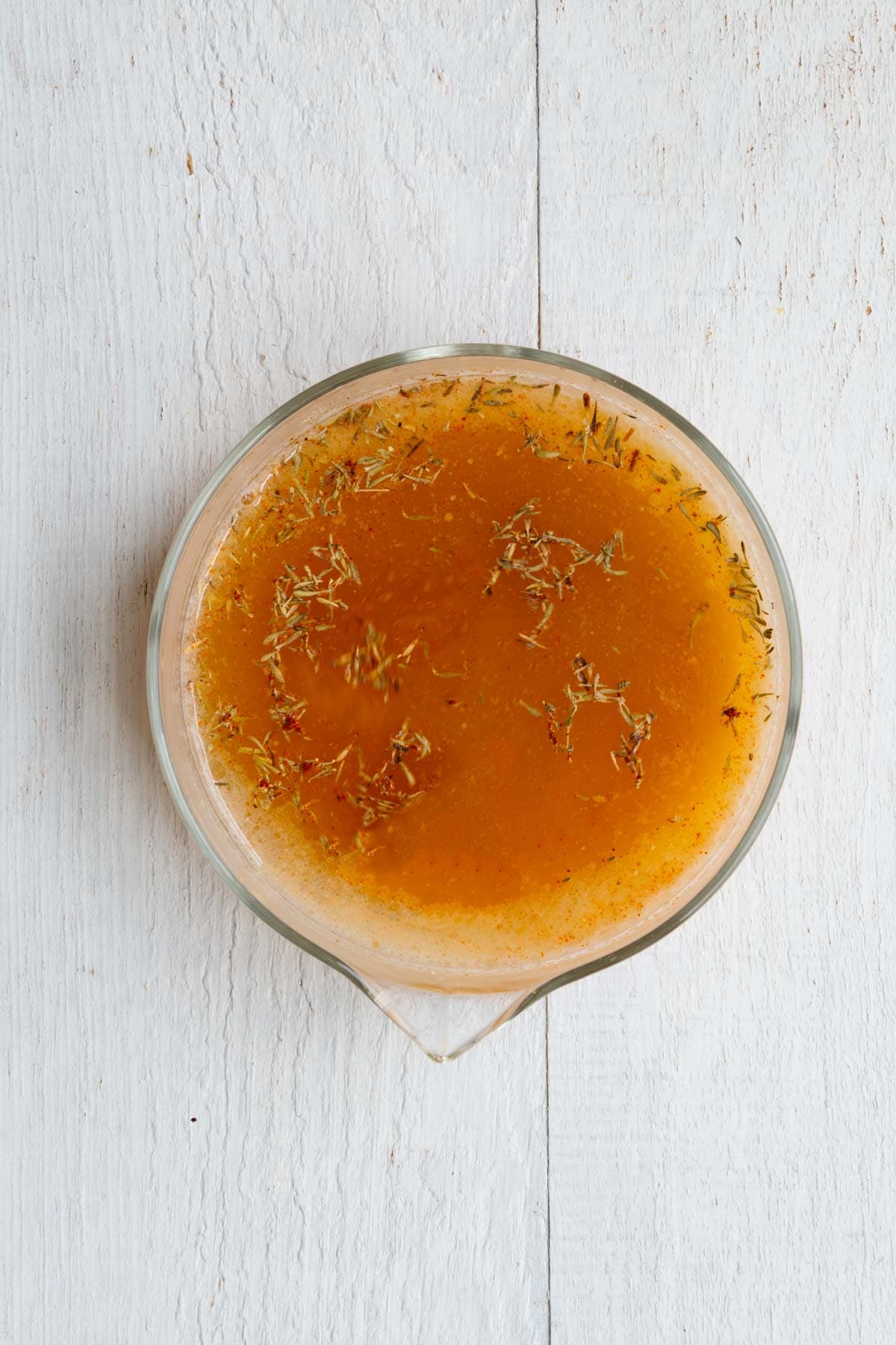 Vegetable bouillon cube dissolved in warm water, with lemon juice, miso, smoked paprika, dried thyme, garlic powder, onion powder, and nutritional yeast.