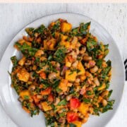 Black eyed peas salad on a white plate and a black fork.