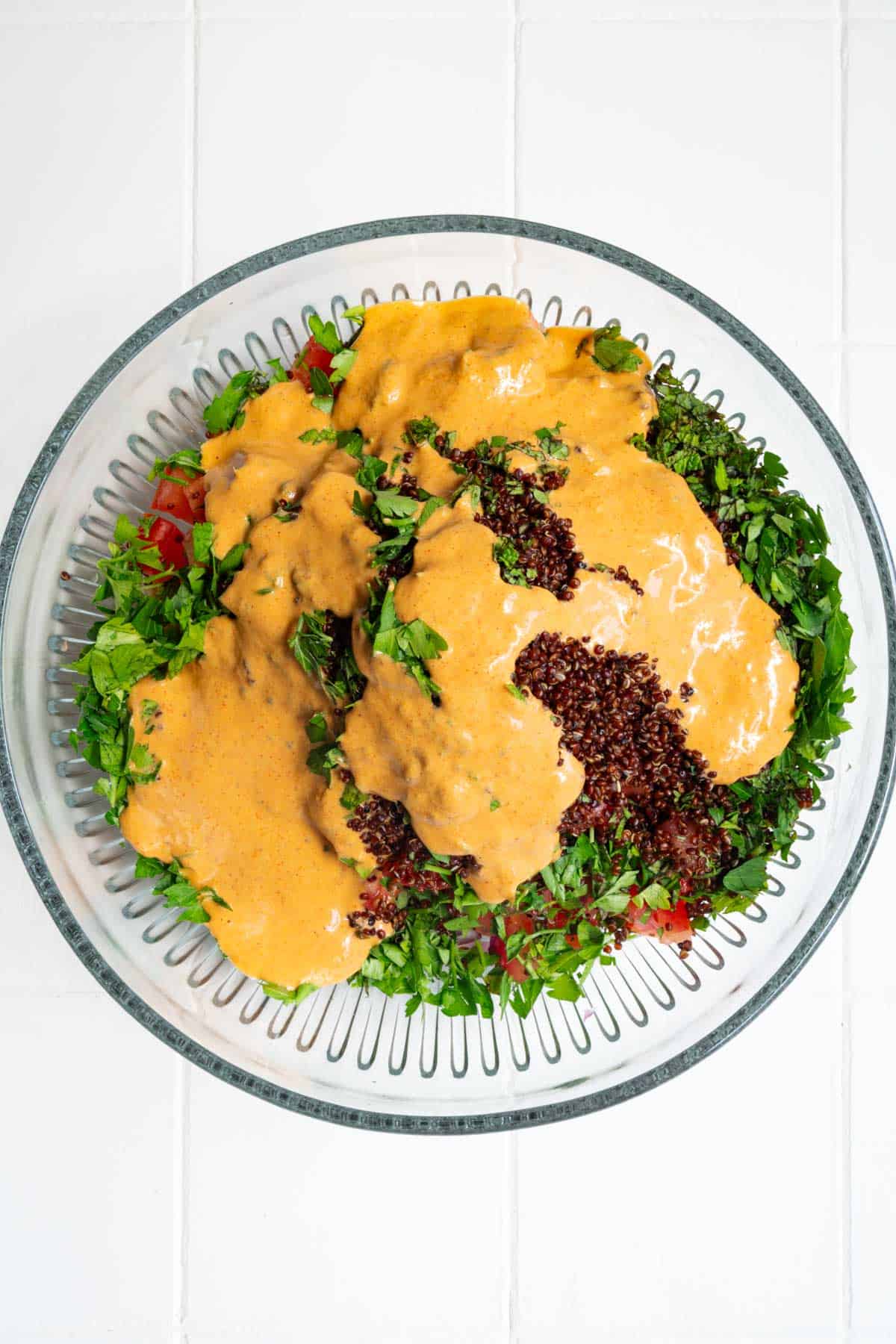 Creamy orange sauce or dressing on salad.