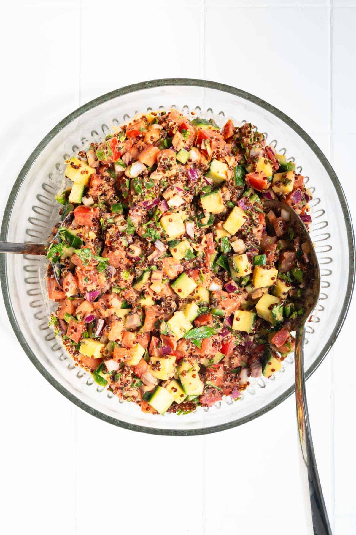 Creamy Oil-Free Quinoa Garbanzo Bean Salad in a glass bowl.