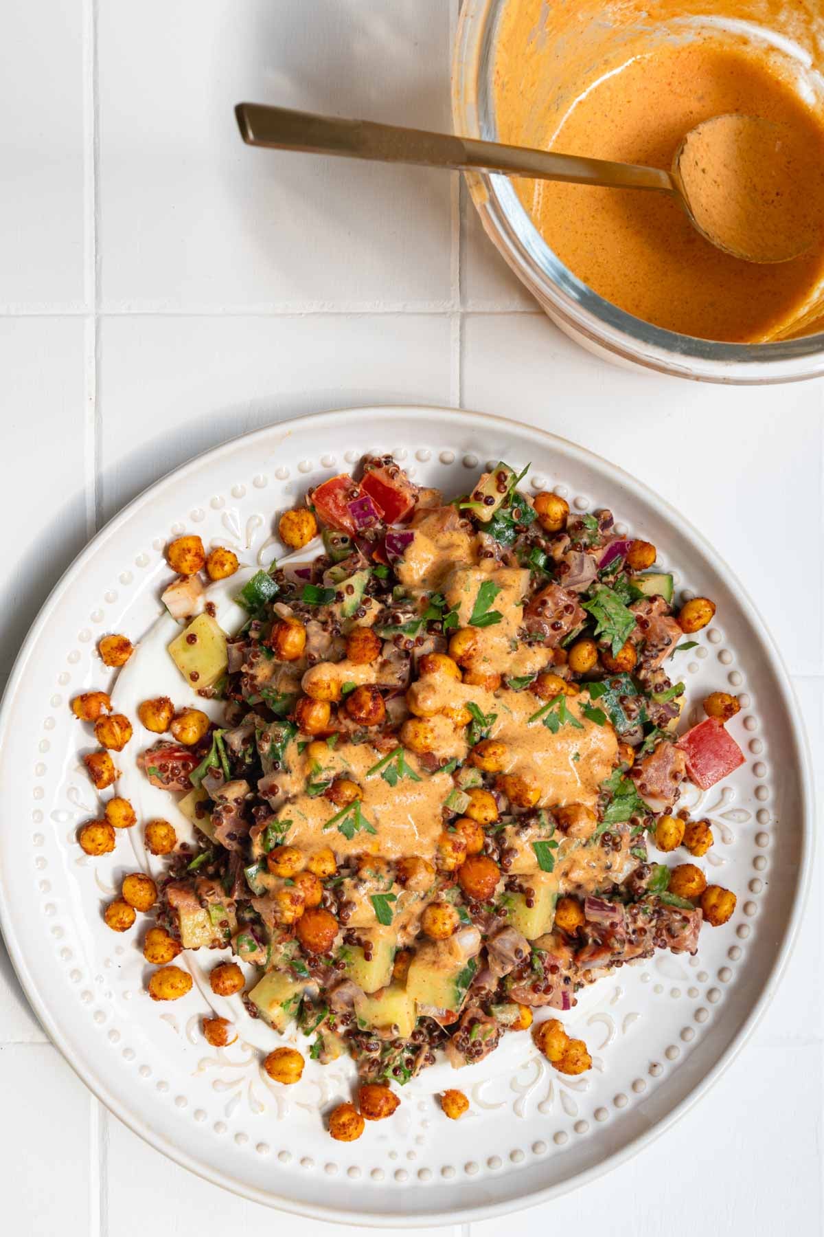 Creamy harissa dressing with Quinoa Chickpea Mediterranean Salad.