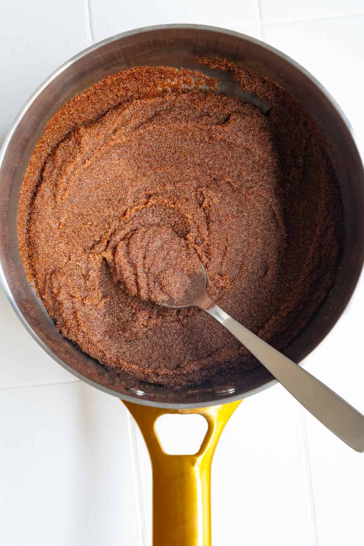 Cooked teff in a saucepan.