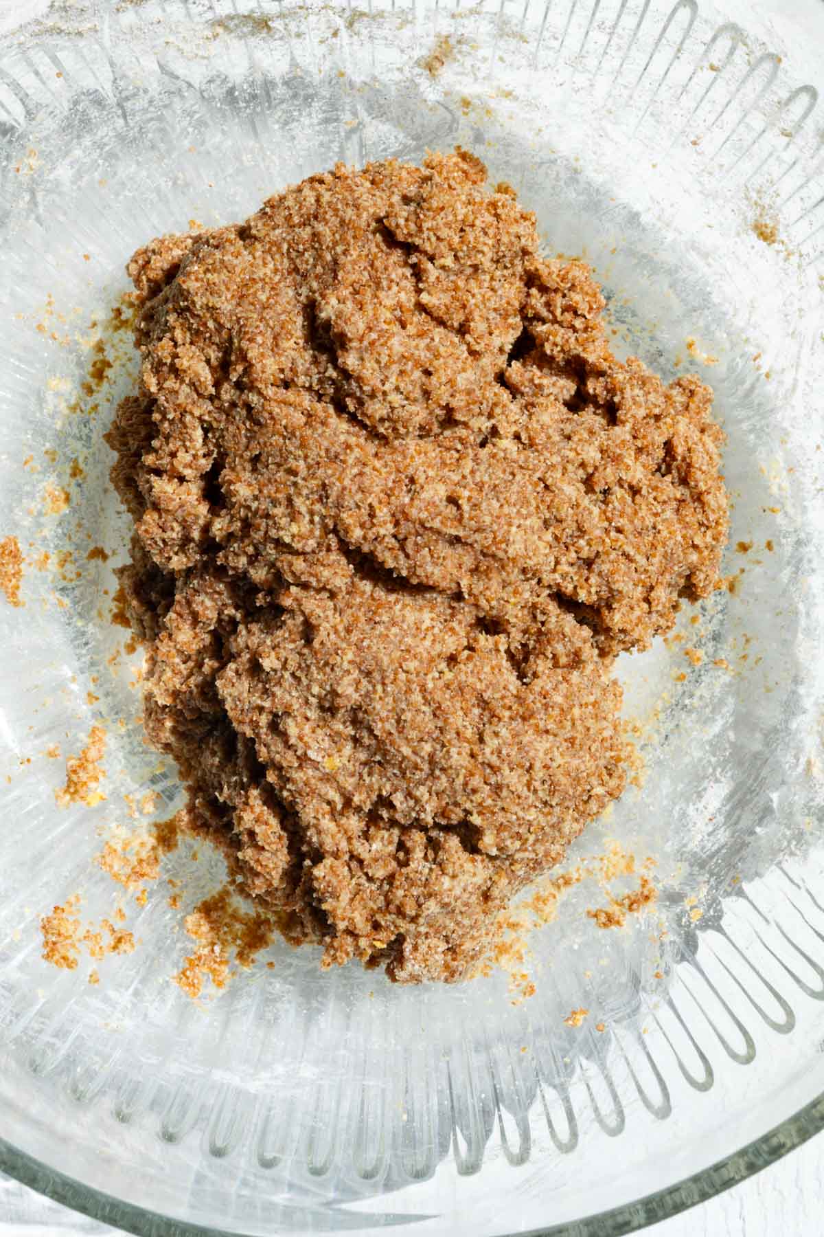 Bread dough in a glass bowl.