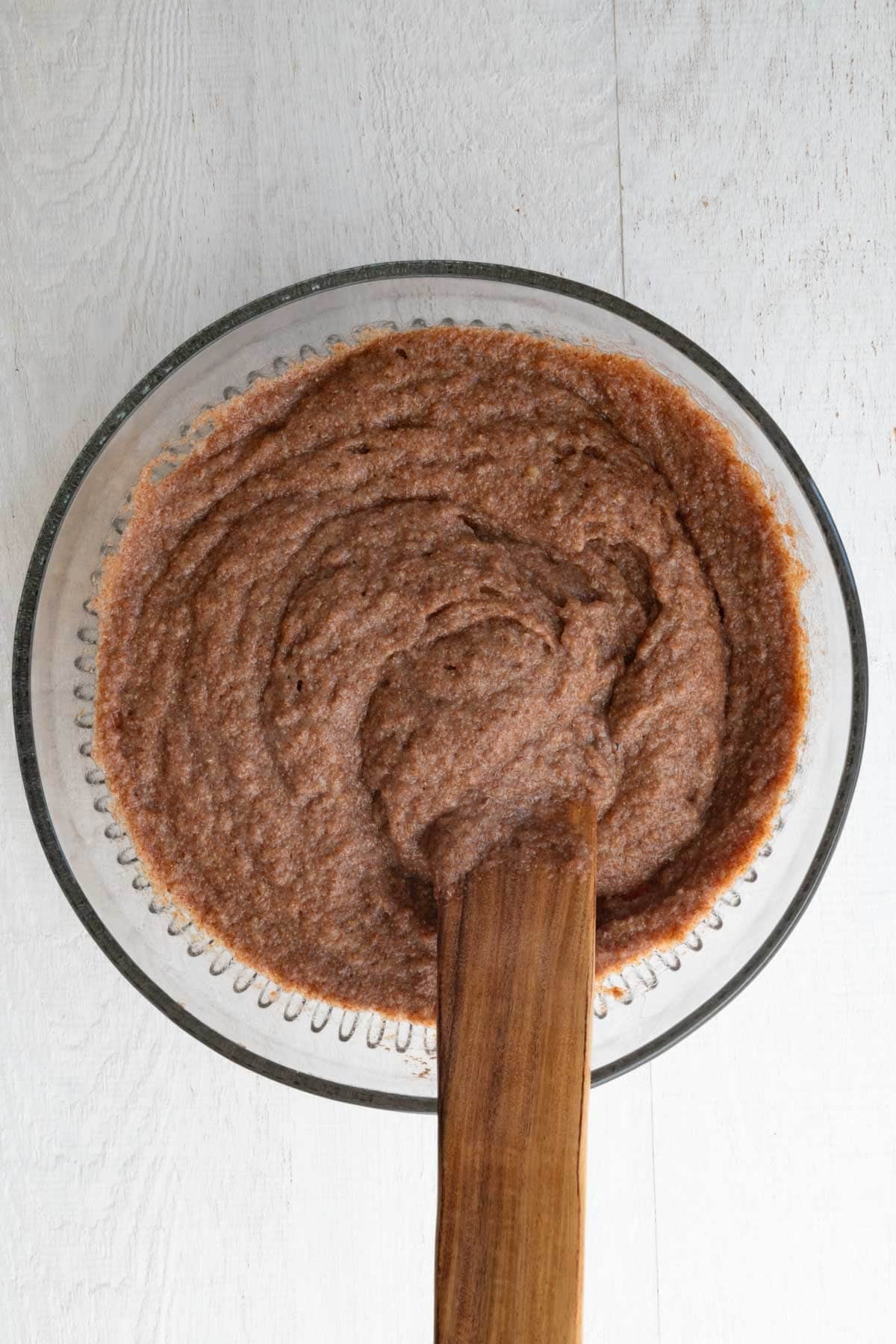 Cake batter in a glass bowl.
