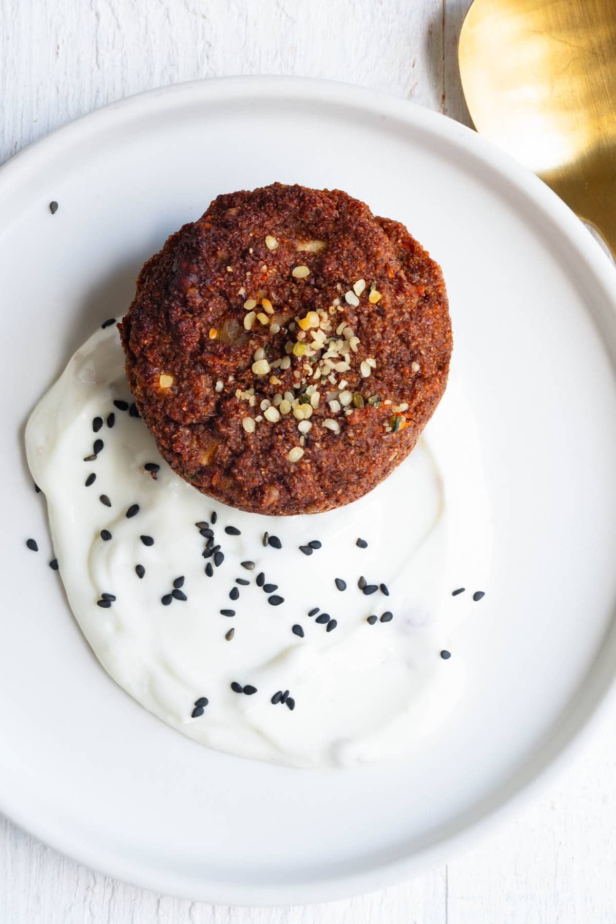 Gluten-free flourless teff breakfast muffin served with yogurt.