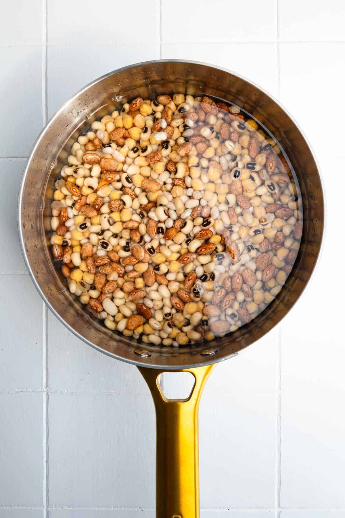 Beans in a saucepan with water to cover.